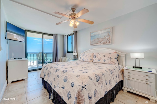 tiled bedroom featuring floor to ceiling windows, ceiling fan, and access to exterior