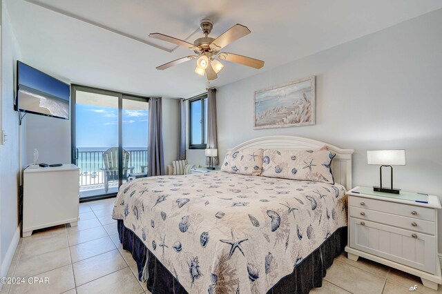 bedroom featuring light tile patterned floors, ceiling fan, access to exterior, and floor to ceiling windows