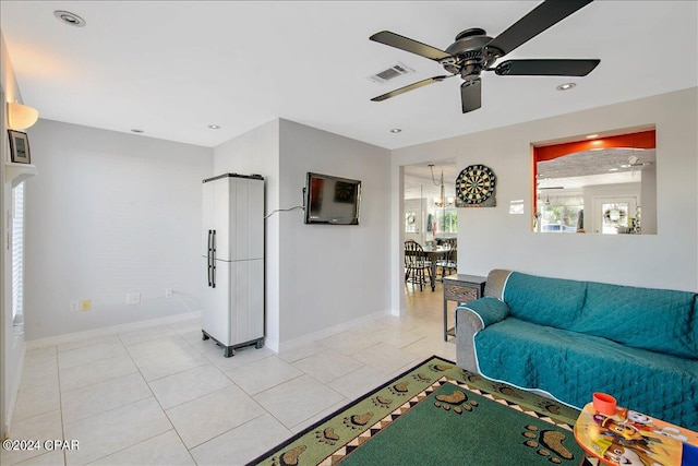 living room featuring ceiling fan and light tile patterned floors