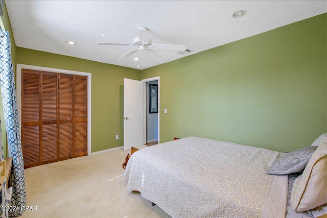 bedroom featuring a closet, carpet flooring, and ceiling fan