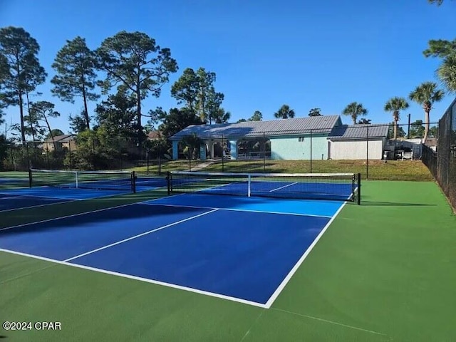 view of tennis court featuring basketball court