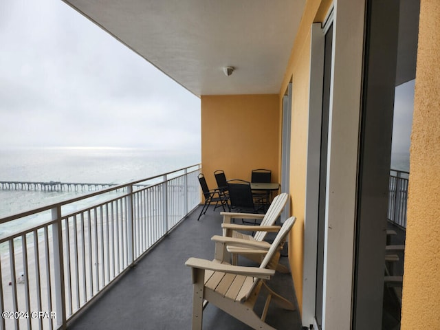 balcony featuring a water view