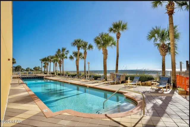 view of swimming pool with a patio