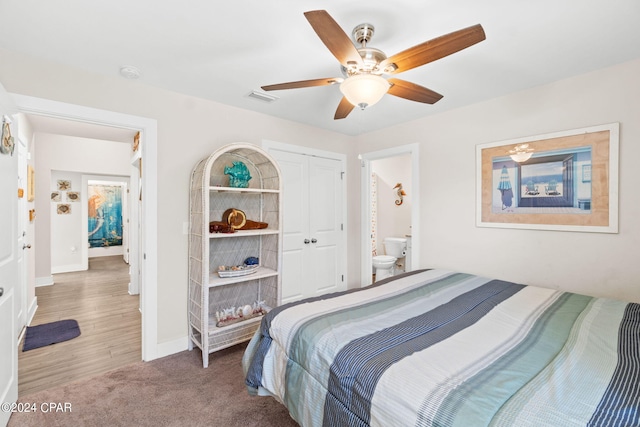 bedroom with ceiling fan, hardwood / wood-style flooring, and ensuite bathroom