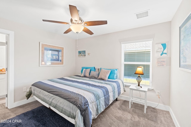 bedroom featuring ceiling fan and carpet