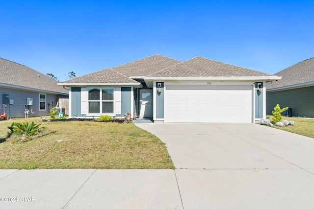 view of front of house with a garage and a front lawn