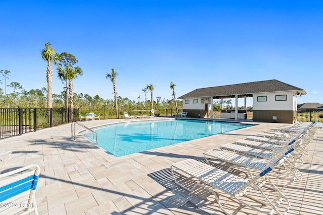 view of swimming pool featuring a patio area