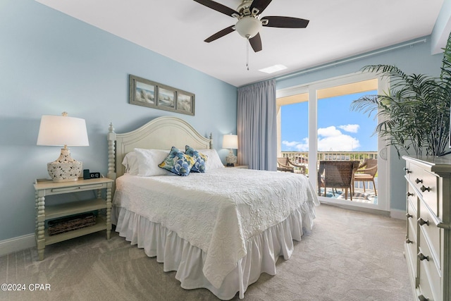 bedroom featuring access to exterior, light carpet, baseboards, and a ceiling fan