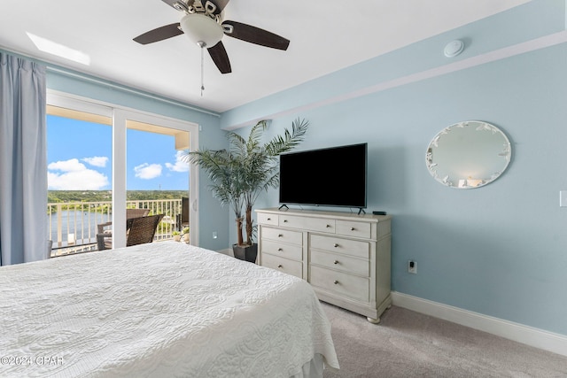 bedroom with access to outside, a ceiling fan, light colored carpet, and baseboards