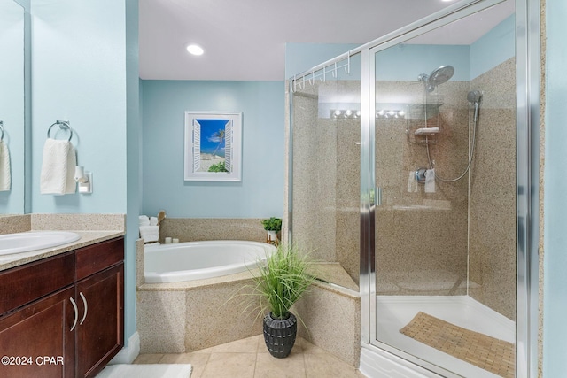 full bath featuring tile patterned flooring, a garden tub, a shower stall, and vanity