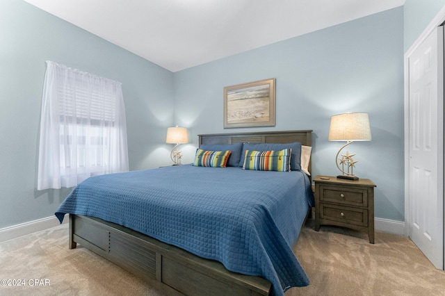 carpeted bedroom with baseboards