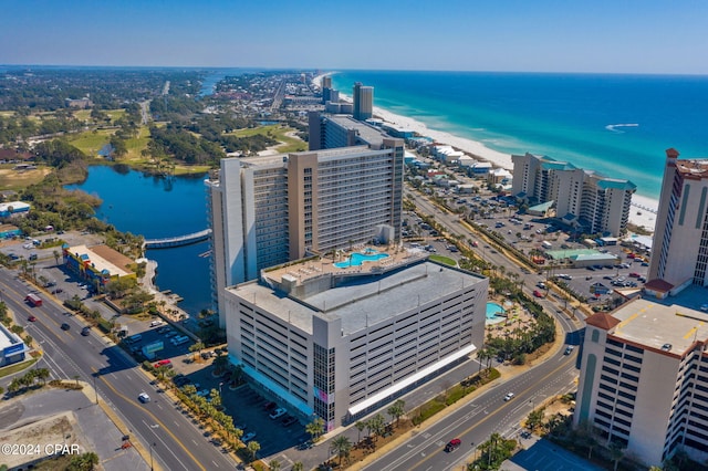 birds eye view of property with a water view and a city view