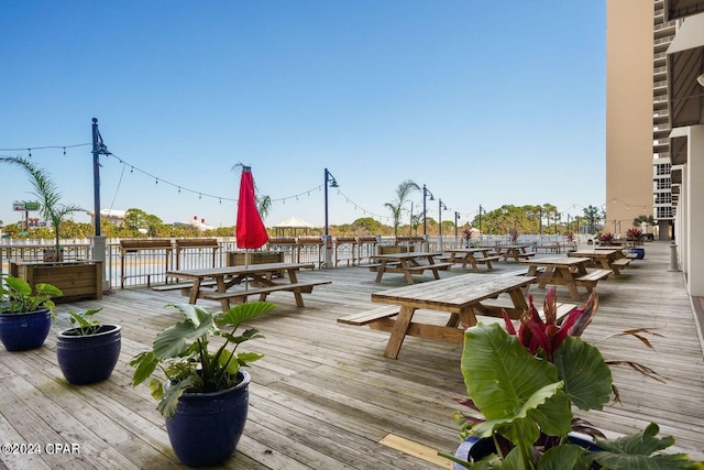 wooden terrace featuring outdoor dining space