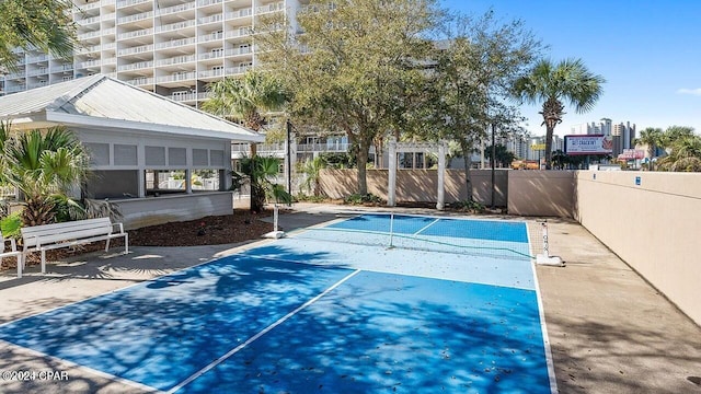 view of swimming pool featuring fence