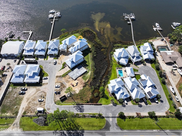 birds eye view of property with a water view