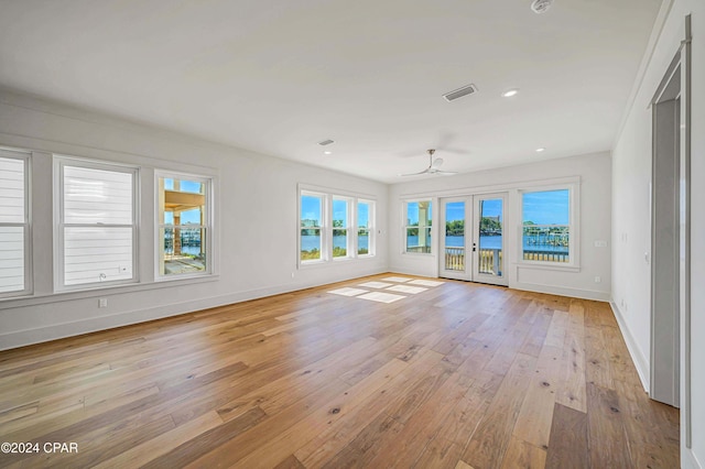 interior space with french doors and ceiling fan