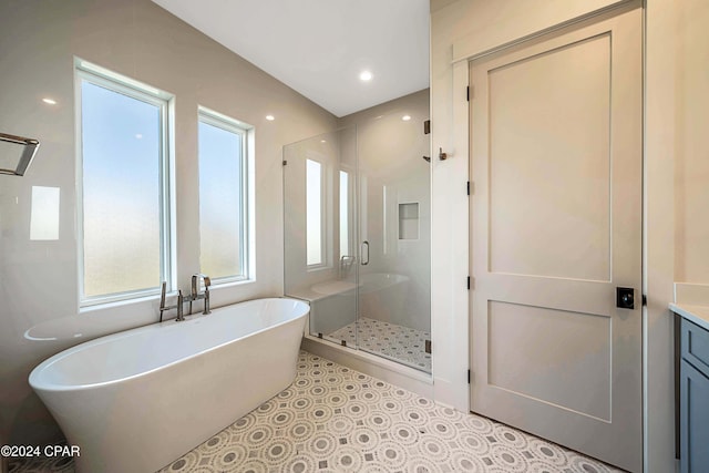 bathroom featuring vanity and separate shower and tub