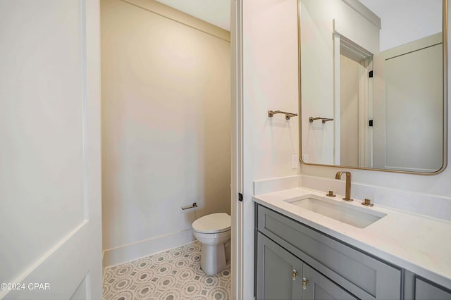 bathroom featuring vanity and toilet