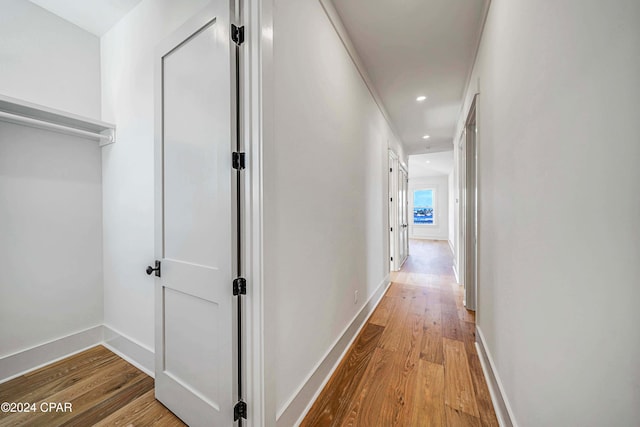 hallway with light wood-type flooring