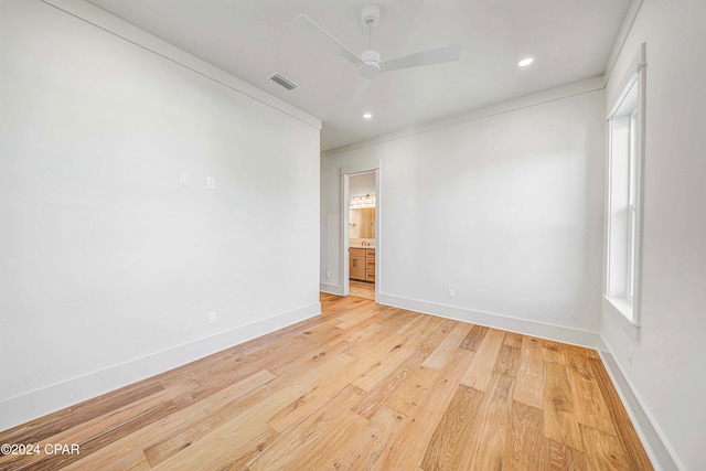 unfurnished room with light hardwood / wood-style flooring and ceiling fan