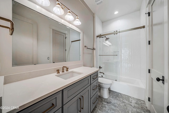 full bathroom with toilet, combined bath / shower with glass door, and vanity