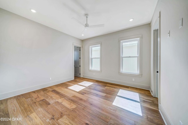 unfurnished room featuring light hardwood / wood-style floors and ceiling fan