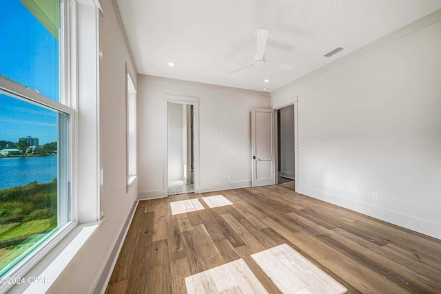 empty room featuring light hardwood / wood-style flooring and ceiling fan