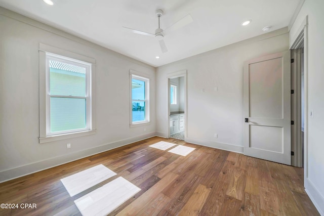 spare room with wood-type flooring and ceiling fan