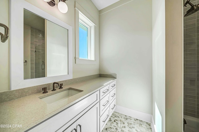 bathroom with vanity, an enclosed shower, and tile patterned flooring