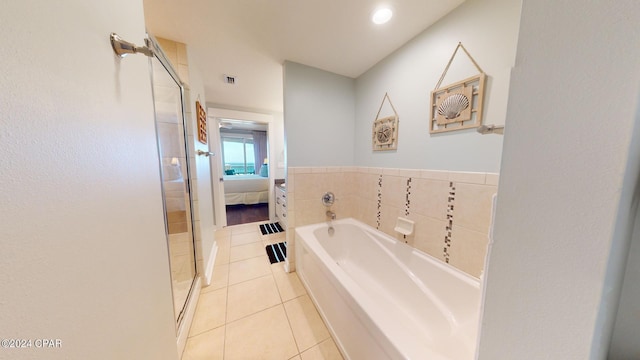 bathroom featuring ensuite bathroom, tile patterned flooring, a garden tub, visible vents, and a shower stall