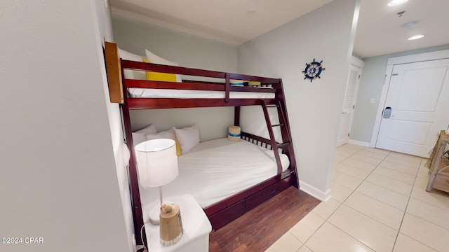 tiled bedroom with baseboards