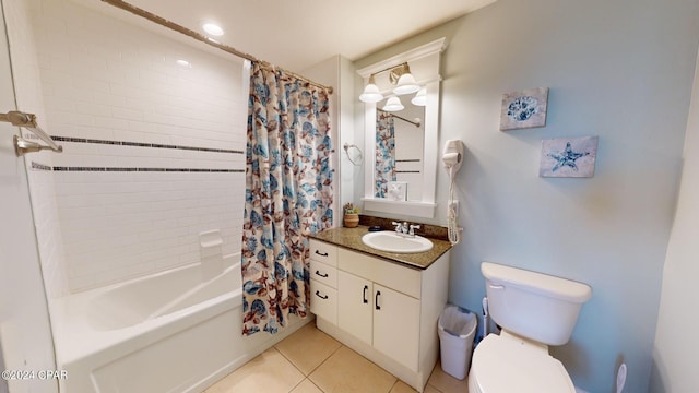 full bathroom featuring shower / bathtub combination with curtain, vanity, toilet, and tile patterned floors