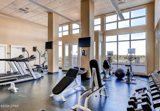 11800 Front Beach Rd Unit 2-504, Panama City Beach, FL 32407 - exercise room featuring a towering ceiling and a drop ceiling