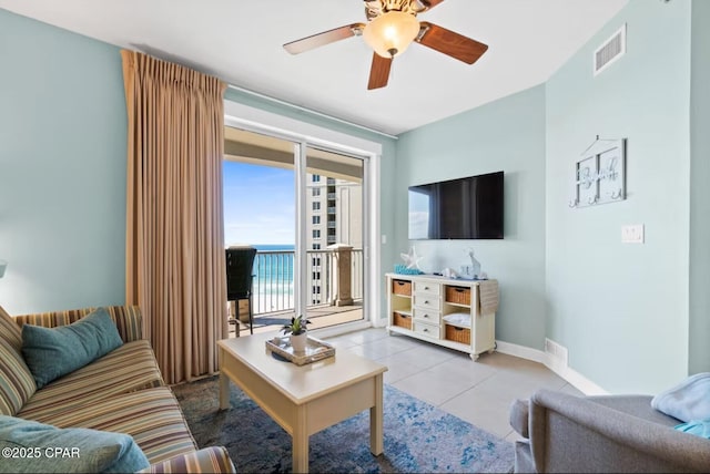 11800 Front Beach Rd Unit 2-504, Panama City Beach, FL 32407 - living room with ceiling fan, baseboards, and tile patterned flooring