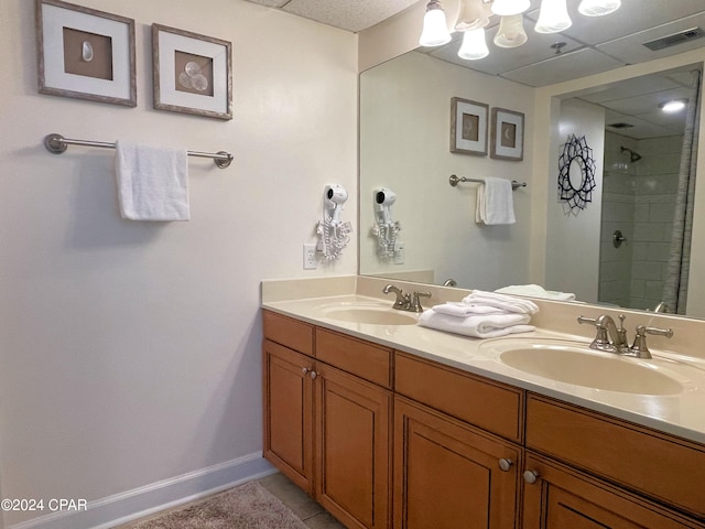 bathroom featuring walk in shower, tile patterned floors, and vanity