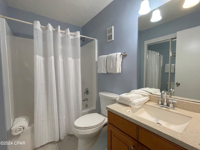 full bathroom featuring vanity, toilet, shower / bath combo, a textured ceiling, and tile patterned flooring