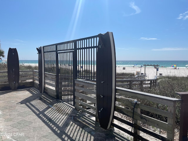 exterior space with a water view and a view of the beach