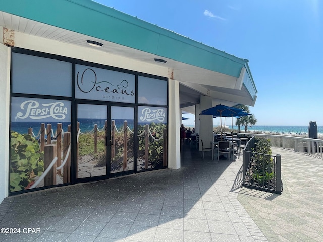 view of patio with a water view