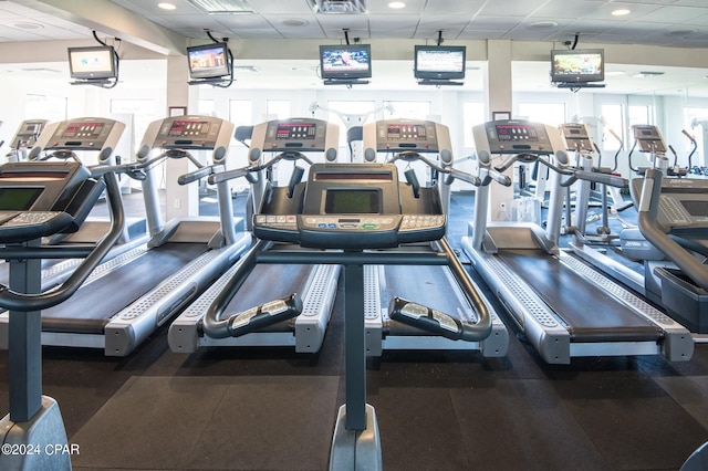 workout area with a paneled ceiling