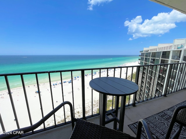 balcony with a beach view and a water view