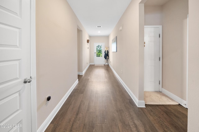 hall with wood-type flooring