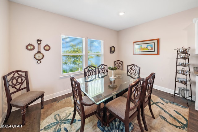 dining space featuring dark hardwood / wood-style flooring