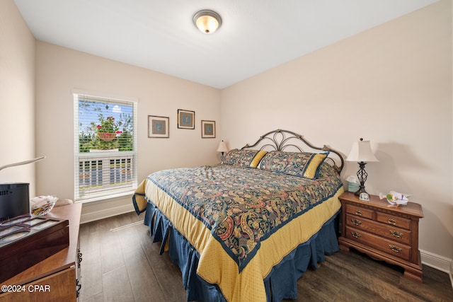 bedroom featuring dark wood-type flooring