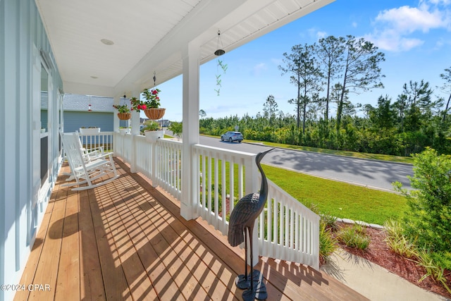 wooden deck with a yard