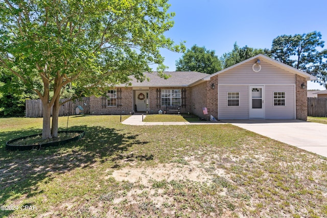 ranch-style home featuring a front yard