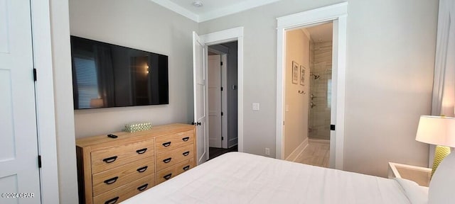 bedroom with wood-type flooring and connected bathroom