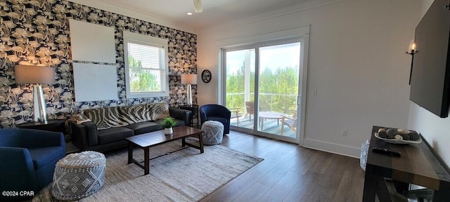 living room featuring crown molding and hardwood / wood-style flooring