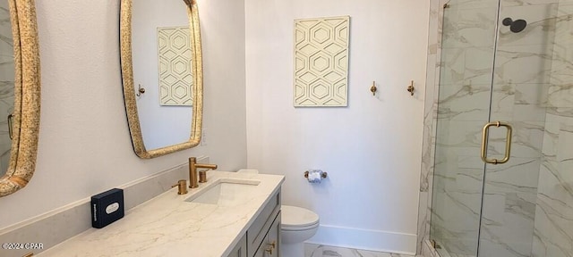 bathroom featuring toilet, vanity, and walk in shower