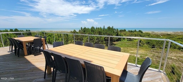 wooden terrace featuring a water view