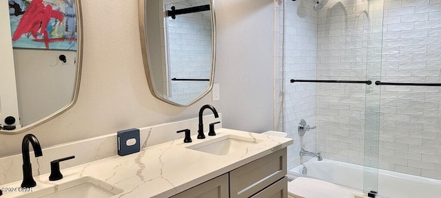 full bathroom with vanity, toilet, and bath / shower combo with glass door